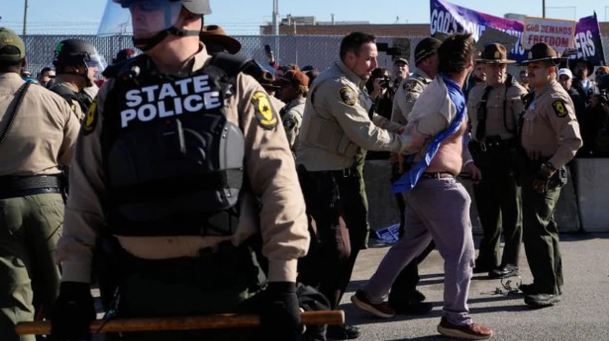 Rev. Michael Woolf among 21 arrested at ICE protest
