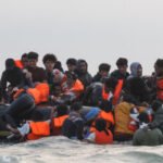 French Police Slash Migrant Boat in Channel Crossing Image 1