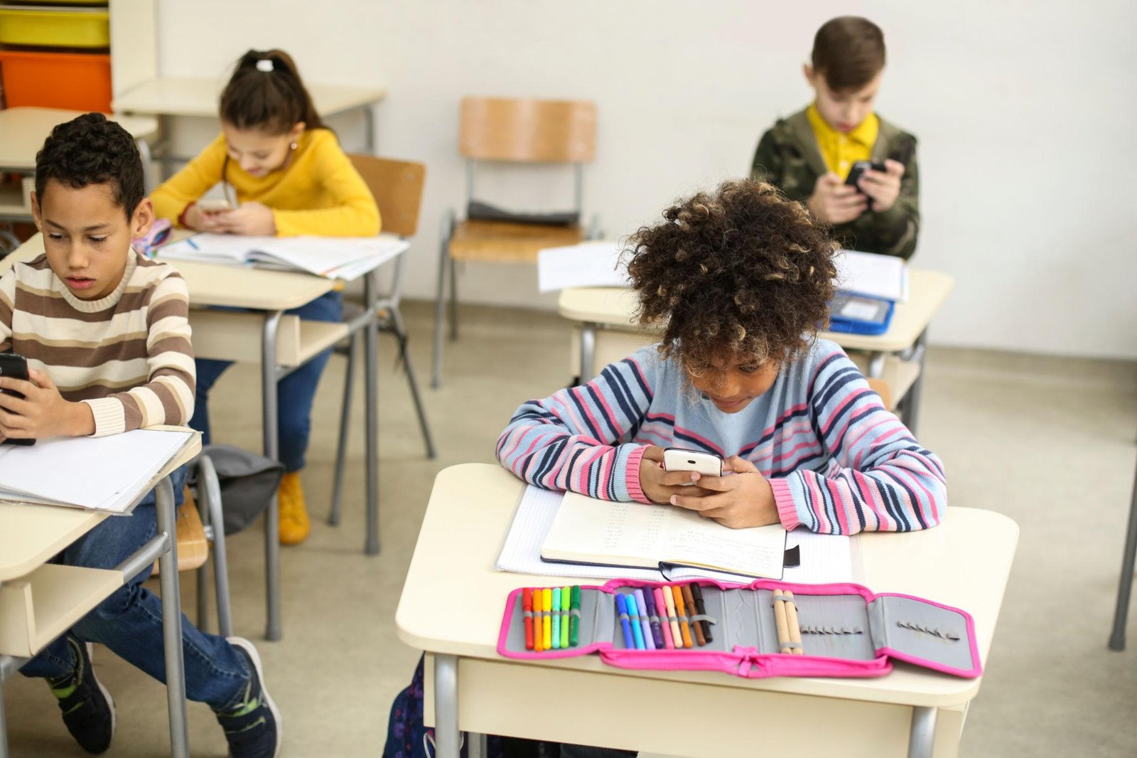 Teenagers using social media during Meta children policy discussions